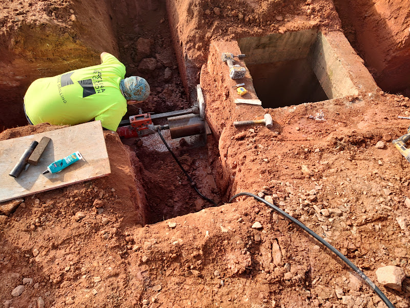 drilling a drainage water basin for new piping